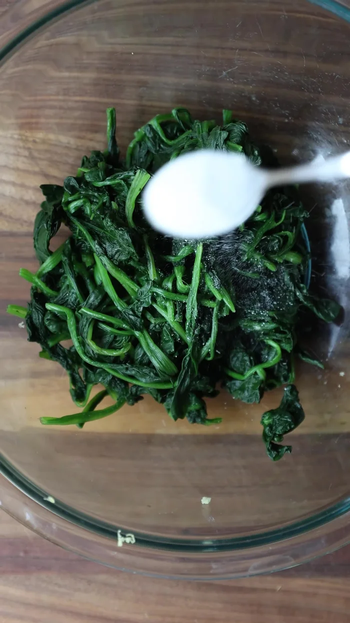 Prepare all filling ingredients: julienne carrots, prepare daikon radish, season, boil spinach, and sauté ingredients.
