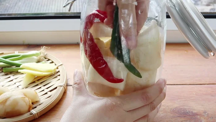 Prepare the chili paste: Combine red chili peppers, green chili peppers, garlic, ginger, scallions, and half an Asian pear.