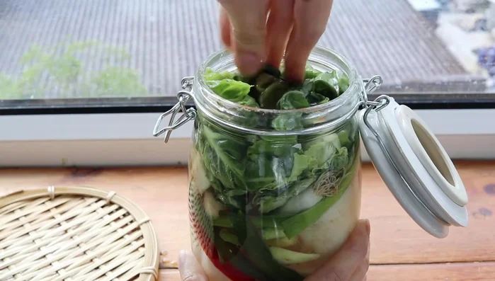 Close the container and place it in a dark, cool place for another 3 days, checking for tangy smells and bubble formation from fermentation.