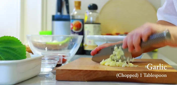 Finely chop a few cloves of garlic to make a tablespoon.
