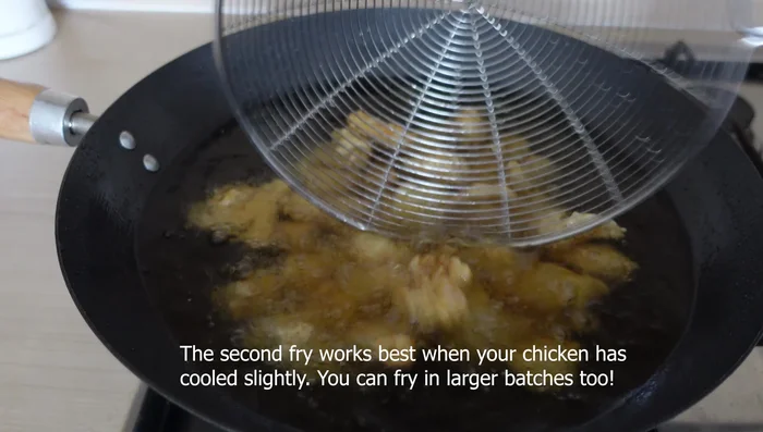 Second fry: Fry chicken in 190°C vegetable oil for 2 minutes until golden brown (111.68).