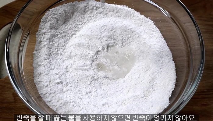 Add hot boiling water and carefully stir to make the dough.