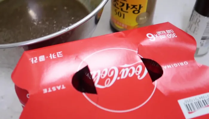 Add Coca-Cola: Gently stir in the Coca-Cola.