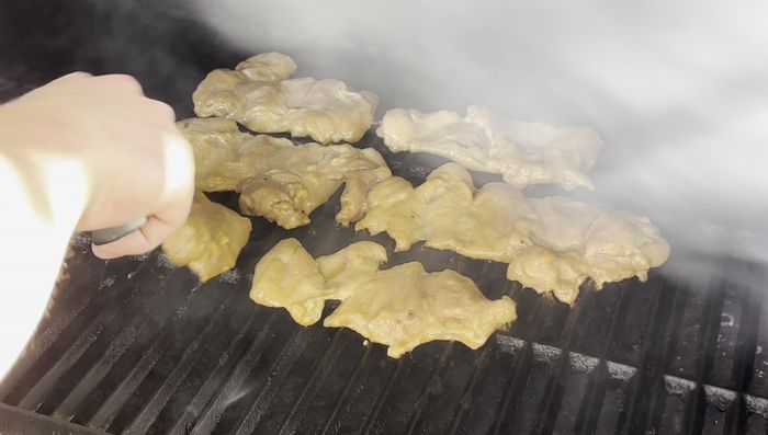 Grill the chicken: Preheat your grill to 450-500°F. Grill the chicken thighs for 2-3 minutes per side, or until the internal temperature reaches 165°F. Alternatively, you can pan-fry or bake the chicken at 400-425°F for about 20 minutes.