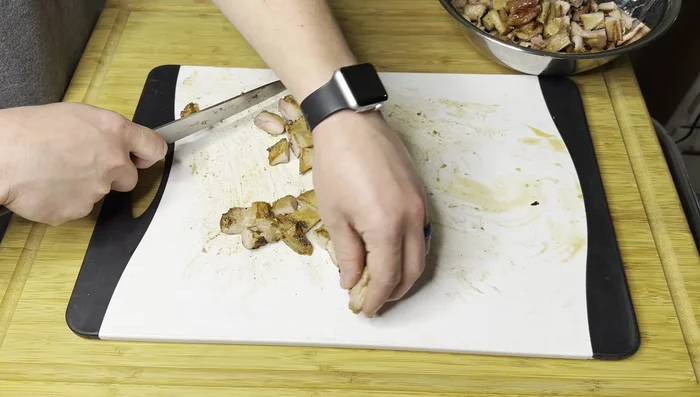 Cut and toss: Once cooked, let the chicken rest slightly, then cut it into small cubes.