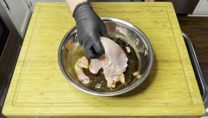 Marinate the chicken: Add the chicken thighs to the marinade, ensuring they are fully coated. Cover with a paper towel and refrigerate for at least 2 hours, or preferably overnight (12-24 hours).
