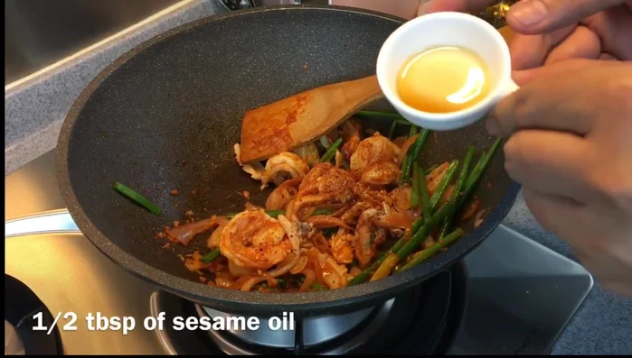 Add sesame oil and sugar. Stir well.
