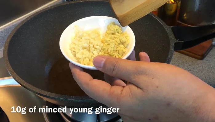 Add ginger and garlic to the hot pan.