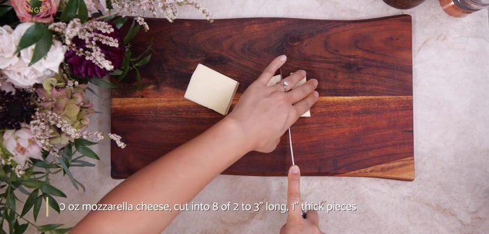 Prepare the cheese: Cut a large chunk of cheese into pieces about 2 inches long and 1 inch wide.
