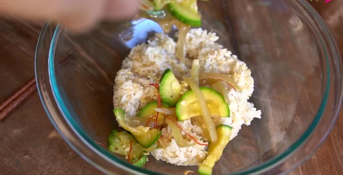 For the bibimbap, mix warm Korean rice with half of the squash side dish (including the juices), avocado cubes, shredded romaine lettuce, gochujang, and toasted seaweed.
