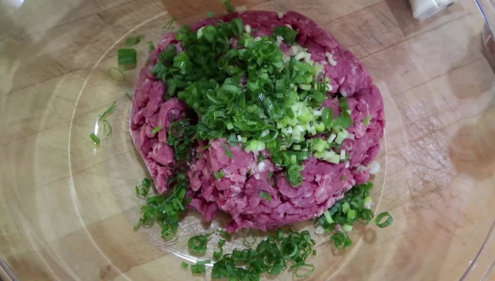 Combine ground meat, tofu, green onions, garlic, salt, and pepper. Mix well and refrigerate for at least 4 hours (or overnight) to marinate.