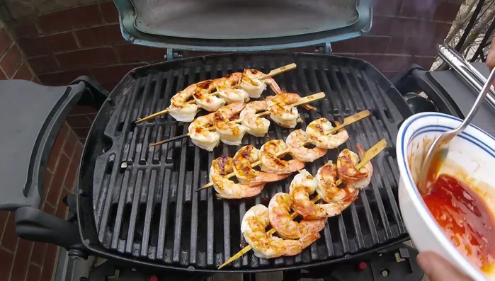 Flip shrimp, baste with remaining glaze, and cook for another 30-60 seconds. [304.639]