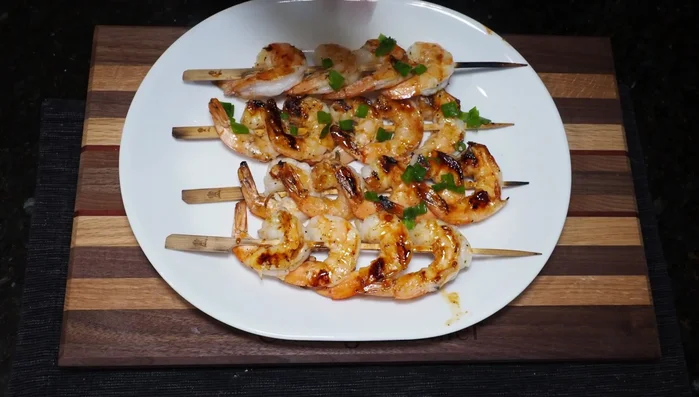 Remove from grill and garnish with chopped green onion and white sesame seeds. [346.4]