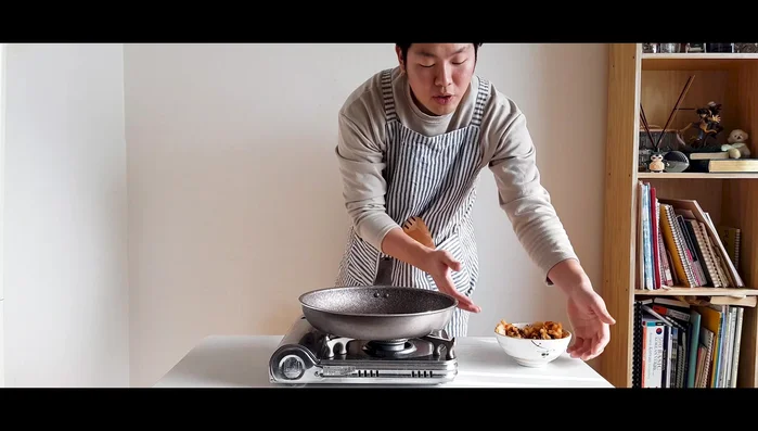 Heat a skillet over medium-high heat. Add sesame oil and sauté kimchi with ½ tablespoon of sugar (optional, depending on kimchi's sourness).