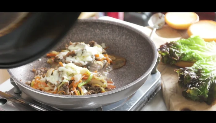 Assemble the burgers: bottom bun, lettuce, bulgogi, kimchi (optional), and top bun.
