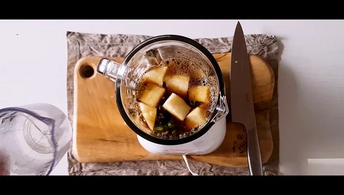 Combine soy sauce, water, sugar, minced garlic, ginger, mirin, and sesame oil in a blender. Blend the sauce with the onion, pear, and pepper.