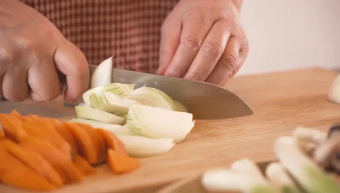 Cut all the vegetables (napa cabbage, string beans, snow peas, mushrooms, etc.) into similar shapes and sizes.