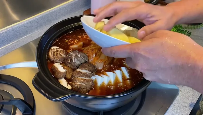 Turn the heat to medium, cover, and bring to a boil.