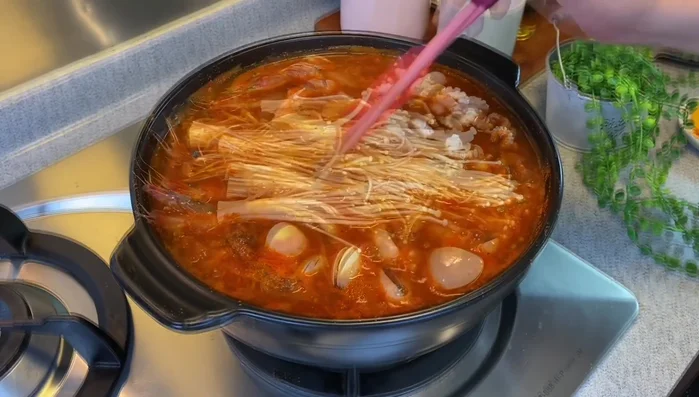 Boil for 3-4 minutes, or until seafood is cooked through. (Note: Soak clams in salted water for 20-30 minutes beforehand to remove sand.)