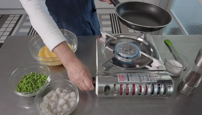 Scramble 5 eggs with a pinch of salt and pepper until fluffy.
