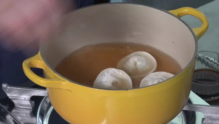 Add the dumplings to the boiling broth. They are ready when they float to the surface.