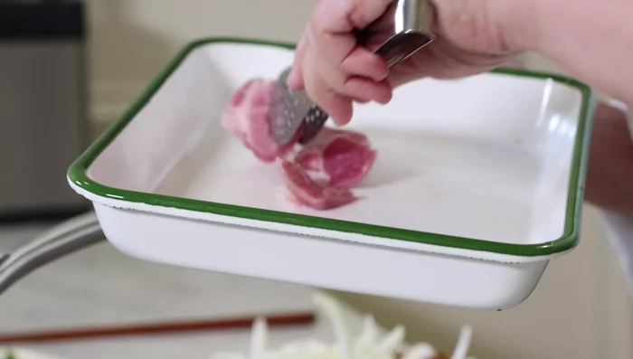 Add the pork to the pan and cook until browned and crispy on both sides. Remove excess oil with paper towels if needed. [196.72]