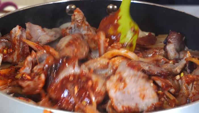 Stir and cook until the meat absorbs the sauce. [313.039]