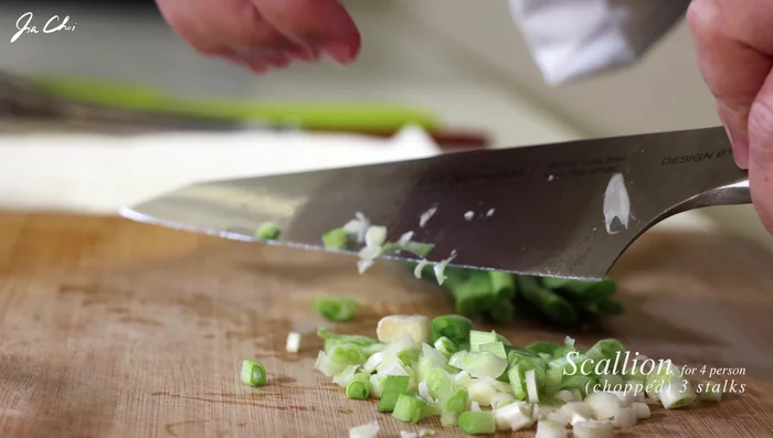 Chop the white parts of scallions (or use green onions). [43.68]