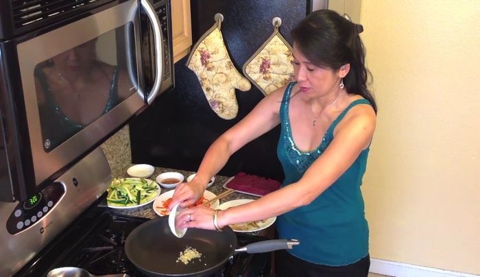 Sauté chopped garlic with brown beef, soy sauce, sesame oil, and sugar.