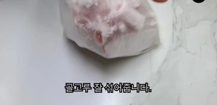 Crack two eggs into the mixture and mix until the egg coats everything.