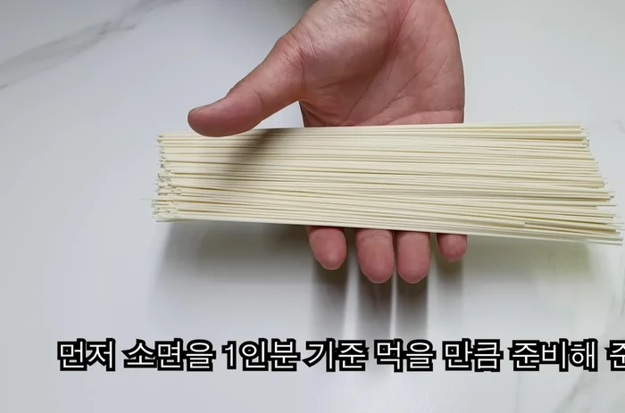 Cook somen noodles in boiling water for 3-4 minutes. Then, rinse with cold water to remove excess starch.