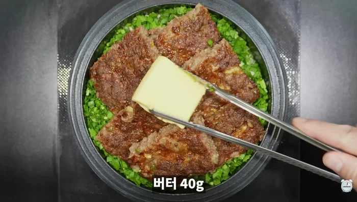 Add butter and sprinkle sesame seeds on top.