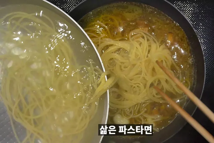 Add boiled pasta noodles to the shrimp oil and garnish. Add salt and pepper to taste.