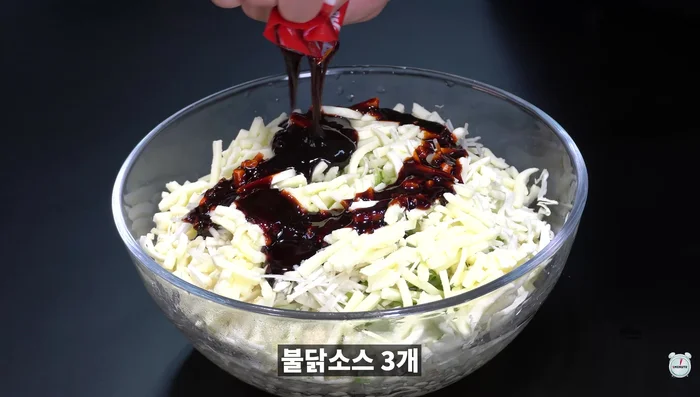 Add buldak sauce, eggs, and pancake mix.