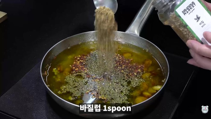 Add minced garlic, chicken stock, crushed pepper, parsley powder, and basil. Mix well.