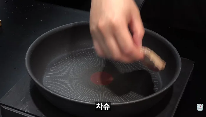 Thinly slice char siu and pan-fry until golden brown.