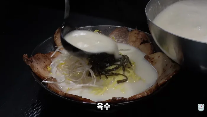 Pour generous amount of broth over ramen.