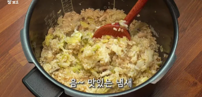 Once the rice is cooked, fluff it with a spatula and mix well with the seasoning sauce.