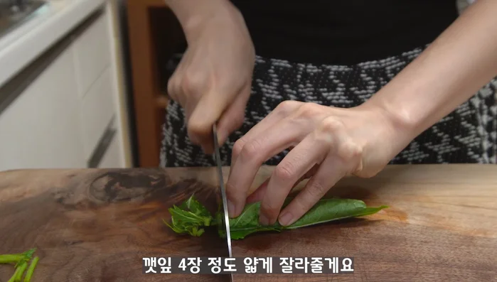 Cooking and preparation process (Unspecified steps). This step involves a significant amount of time judging from the duration of the music.
