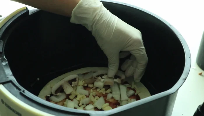 Sprinkle pizza cheese on top.
