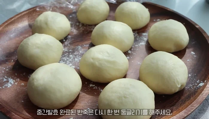 Shape the dough into balls again, removing all air inside and pinching the bottom tightly.