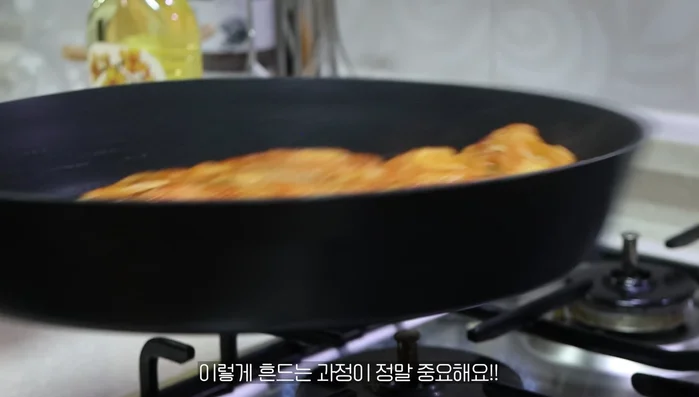 Once flipped, gently shake the pan to prevent sticking and ensure even cooking.