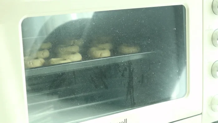 Once baked, place chocolate balls onto the cookies.