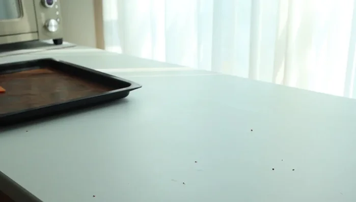 Melt chocolate pen in warm water.