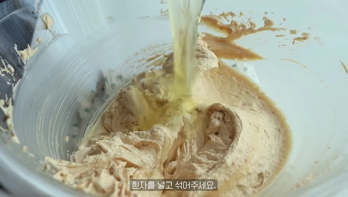 Add the egg white and mix. Room temperature eggs are recommended.