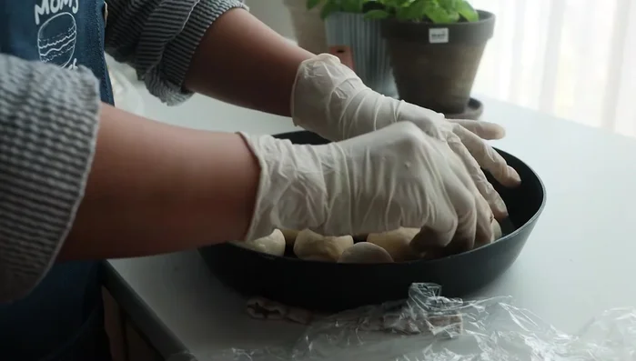 Roll the dough and place it on the prepared pan.