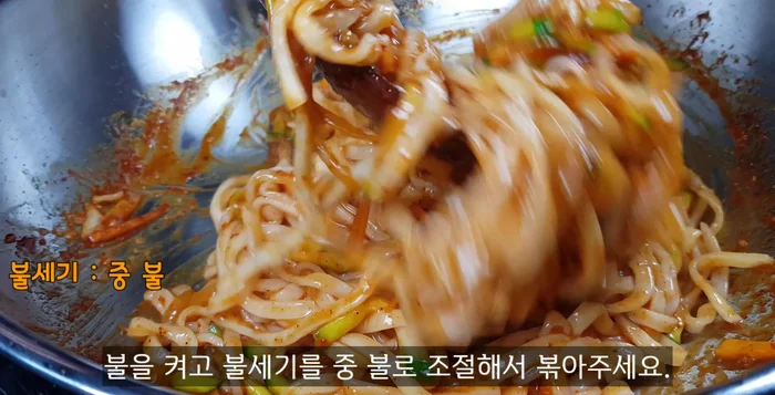 Stir-fry for about 1 minute until noodles and seasoning are well combined. Add 1 spoon of sesame oil and 1 spoon of sesame seeds. Mix and turn off the heat.