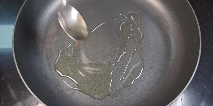 Heat the pan with 2 spoons of cooking oil. Fry the ham until lightly golden brown.