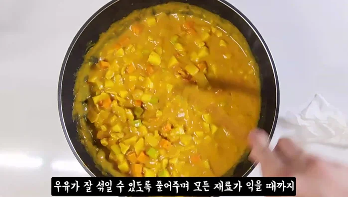 Add milk to adjust consistency. Stir well and continue to cook until all ingredients are tender.