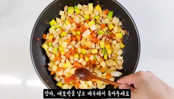 Add potatoes, carrots, onions, and zucchini. Stir-fry for about 5 minutes.